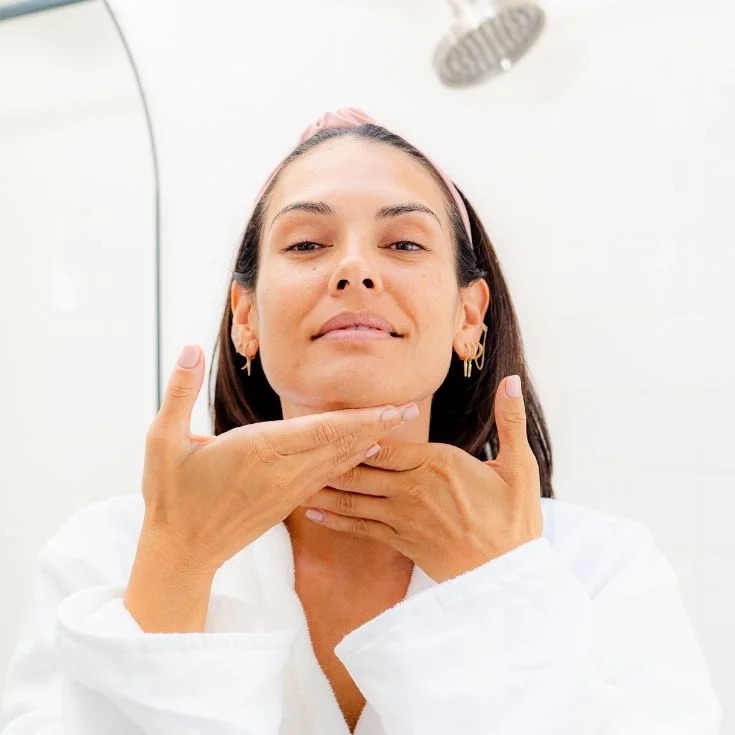 Smoothing the serum over the neck